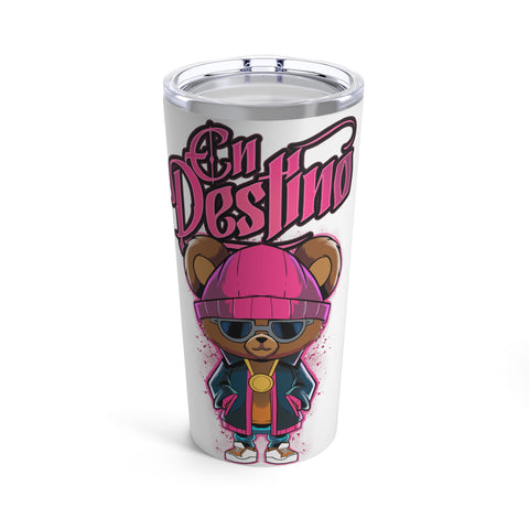 This tumbler showcases a charming design of a teddy bear, exuding a cool and calm vibe while wearing dark sunglasses. The phrase "En Destino" elegantly appears at the top of the design in a vibrant pink color, adding a playful touch to the overall aesthetic. This tumbler is perfect for anyone who loves unique and fun drinkware!