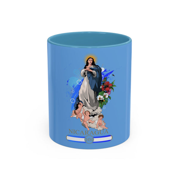 A blue ceramic coffee mug featuring a Tropical flowers design and an illustration of the Virgin Mary with a child, labeled 'NICARAGUA' at the bottom.