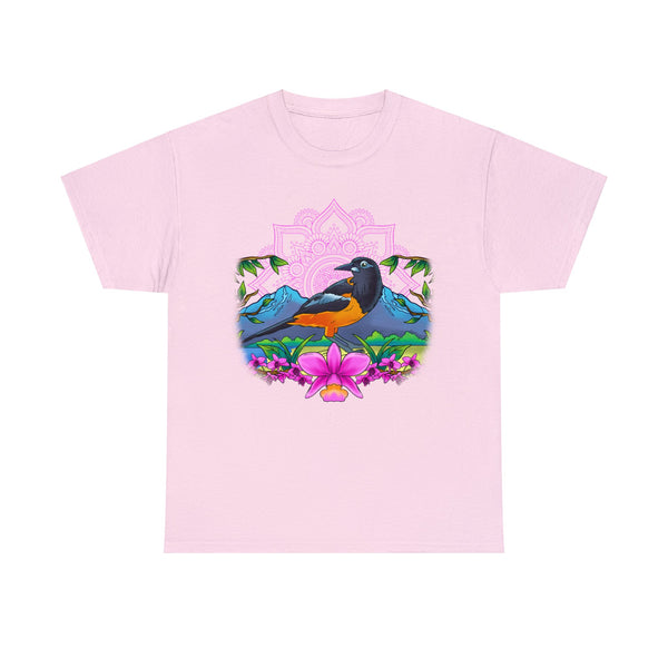 A women's T-shirt featuring a troupial, the national bird of Venezuela, surrounded by vibrant pink flowers, with majestic mountains in the background.