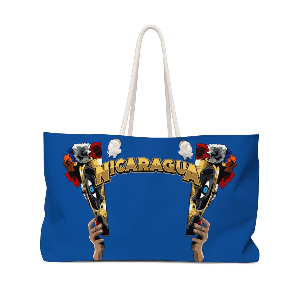 This Macho Rato face Weekender Bag features a unique design split into two halves, with the word "Nicaragua" in gold in the center.