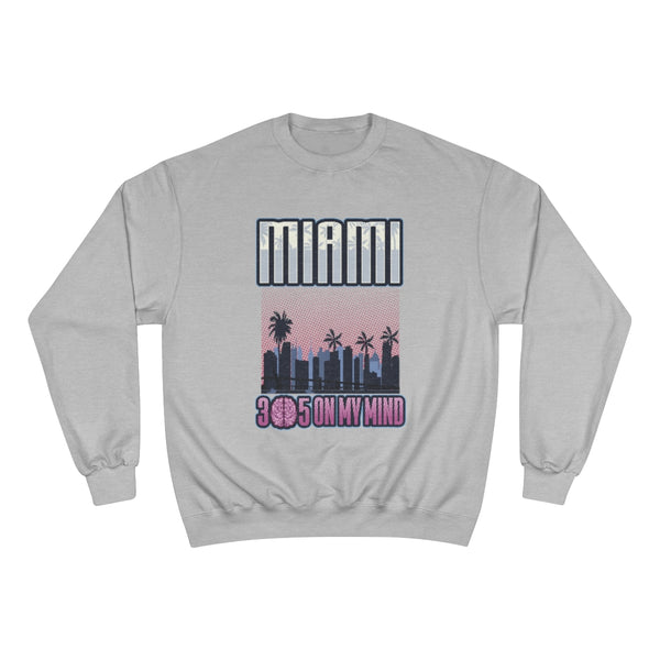Introducing the Miami Streetwear sweatshirt, a stylish and unique piece that captures the essence of the vibrant city of Miami. The design features a stunning skyline of Miami, showcasing its iconic architecture. At the top, the word "Miami" stands out, while at the bottom, the number "305" is creatively transformed with the "0" replaced by a brain, giving it a playful twist. The phrase "305 on my Mind" beautifully ties the design together, making this sweatshirt not just a fashion.